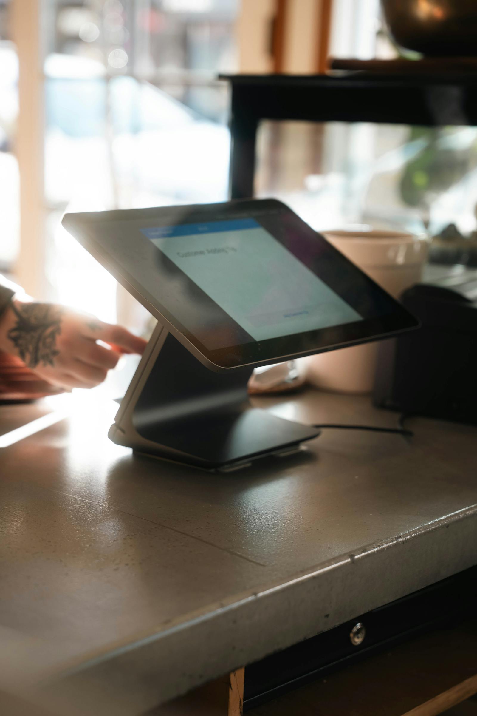 Modern POS system on a coffee shop counter